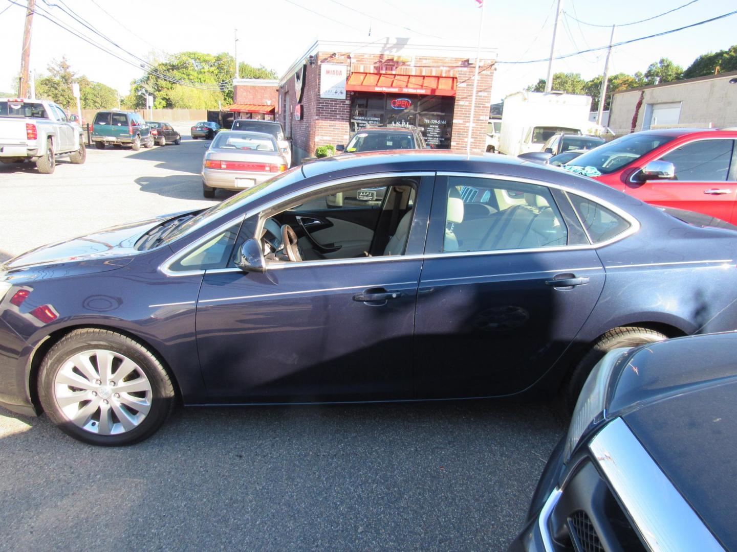 2015 Blue /Tan Buick Verano Base (1G4PP5SK0F4) with an 2.4L L4 DOHC 16V FFV engine, 6-Speed Automatic transmission, located at 215 Milton St, Dedham, MA, 02026, (781) 329-5144, 42.241905, -71.157295 - This nice sedan is in excellent condition. A few minor scratches on top surface's. To be expected on a 10 year old vehicle. Runs great. All ASPI Motor Cars vehicles are fully serviced before they are delivered to assure the highest quality used vehicles. Comes with a 3/3 warranty included in the pr - Photo#4